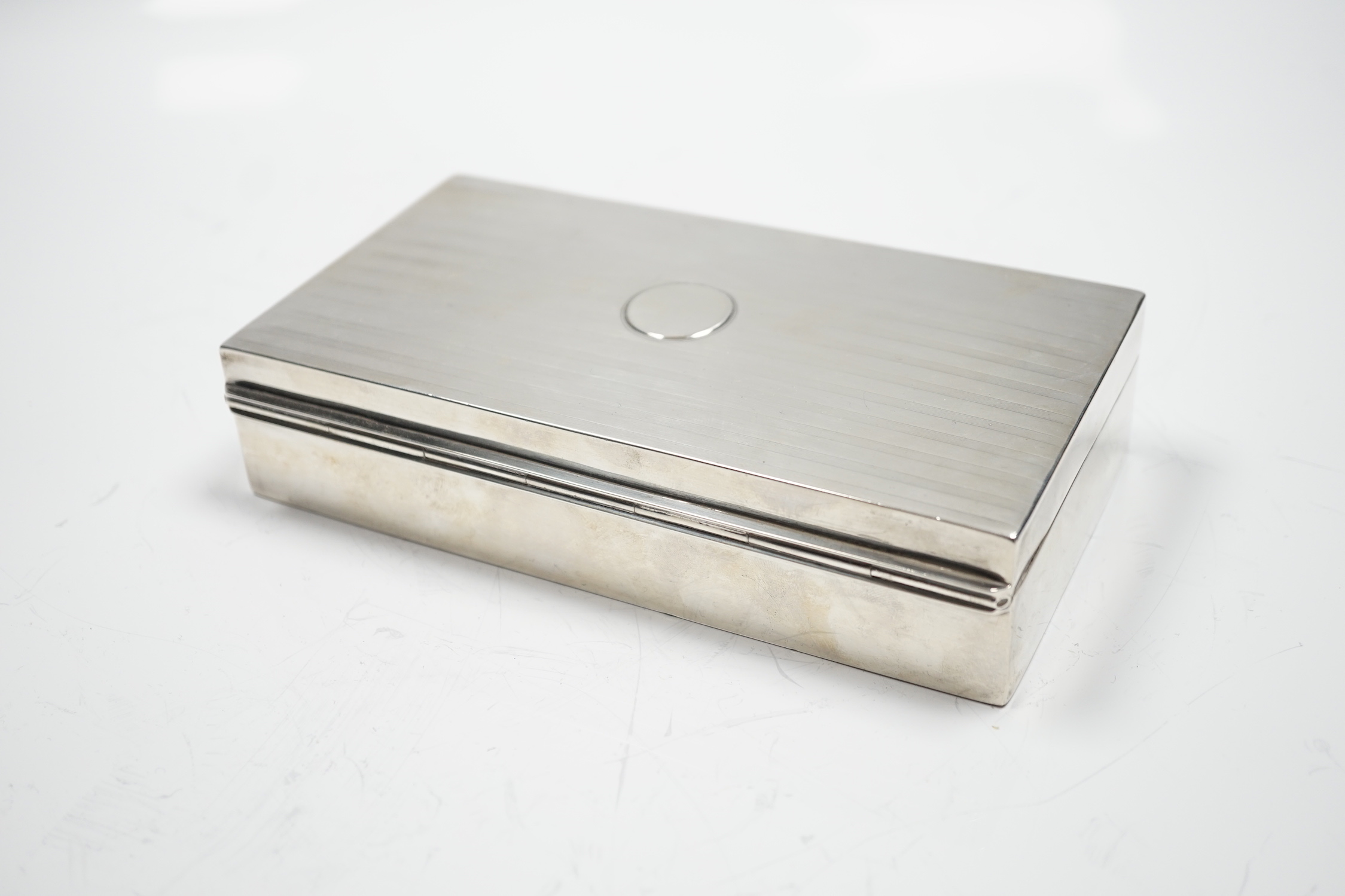 A George V silver mounted rectangular cigarette box, Birmingham, 1918, 17.2cm.